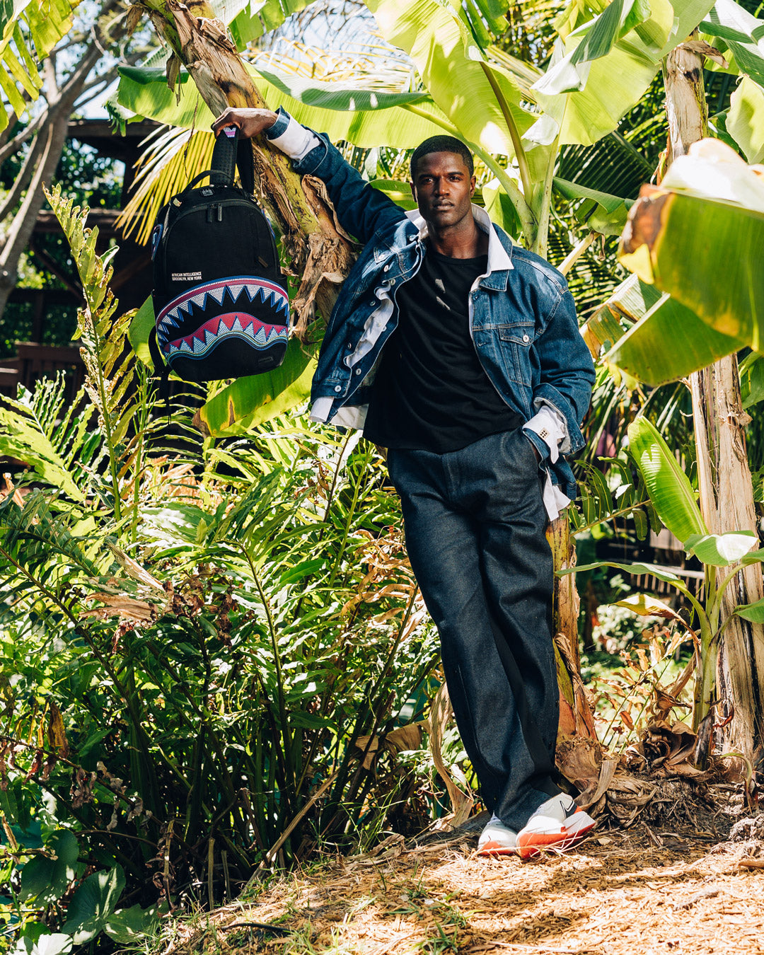 SPRAYGROUND® BACKPACK A.I. AFRICAN INTELLIGENCE BORN AND RAISED BACKPACK - SANDFLOWER COLLAB